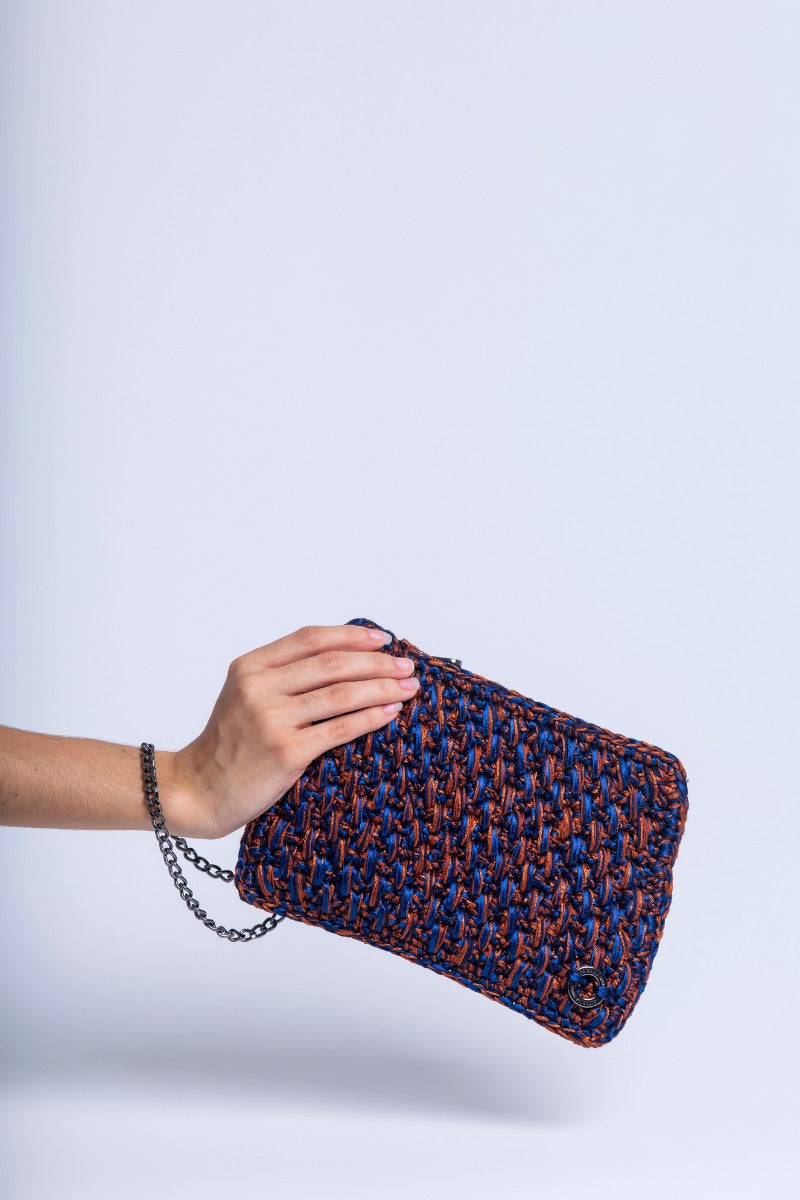 Catarina Mina Brisa terrablue clutch bag with woven design and gold clasp, stylish accessory for evening or special occasions.