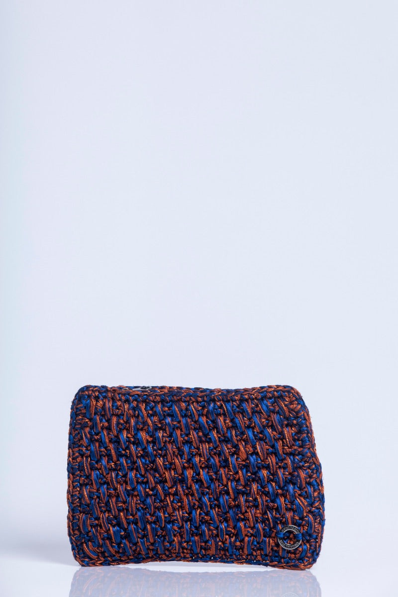 Catarina Mina Brisa Terrablue clutch bag with woven design and leather strap, elegant accessory for evening or casual occasions.