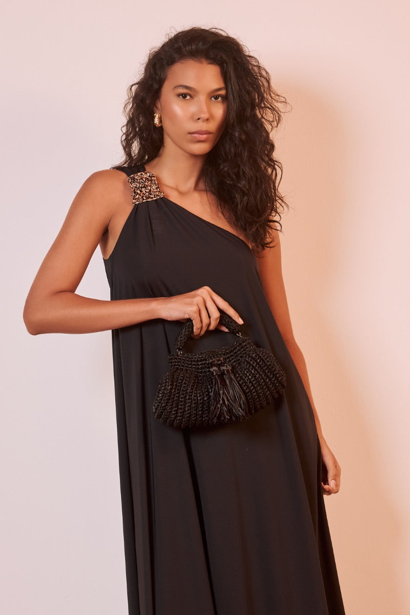 Black Catarina Mina Cantiga clutch bag with sleek design and elegant fold-over closure.