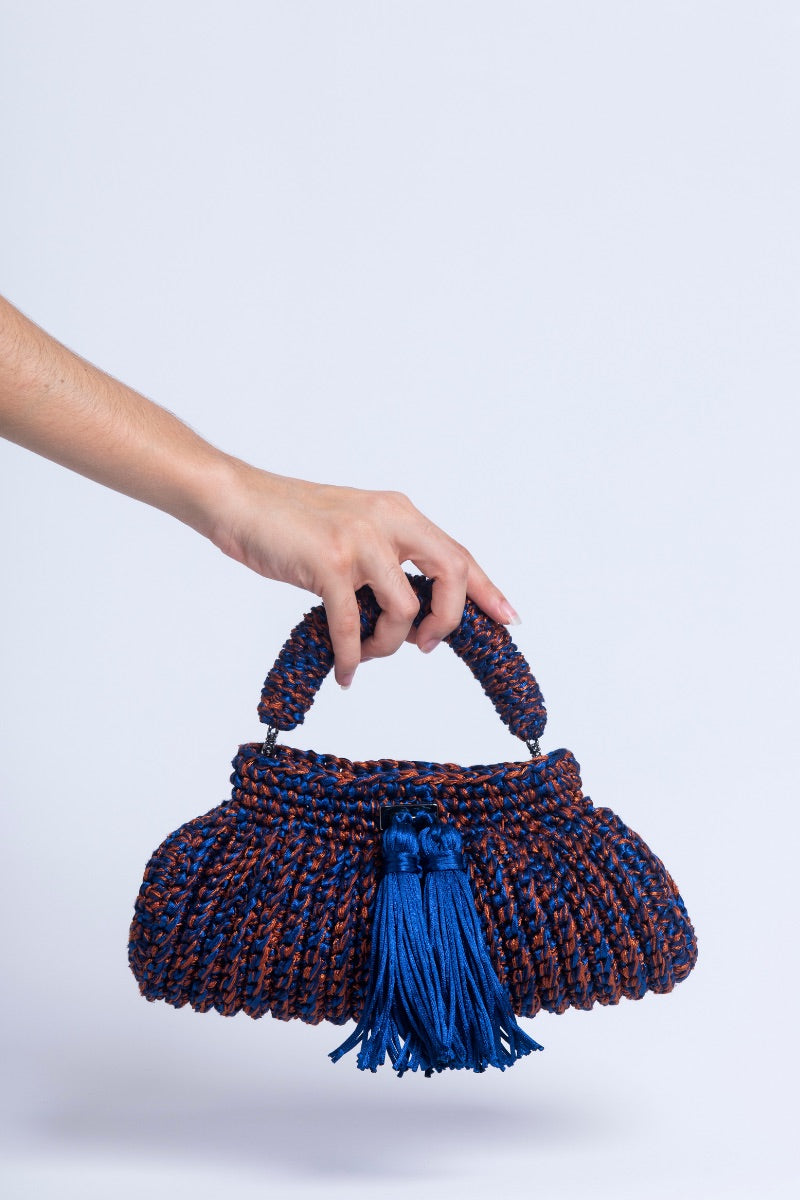 Catarina Mina Cantiga Terrablue clutch bag with textured leather and elegant design, featuring a top handle and compact size.