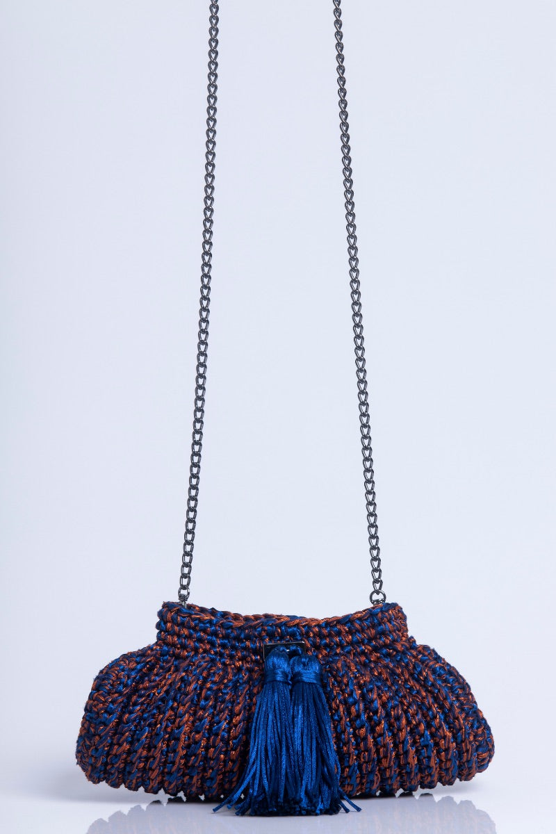 Catarina Mina Cantiga terrablue clutch bag with intricate design and gold clasp, stylish accessory for evening occasions.