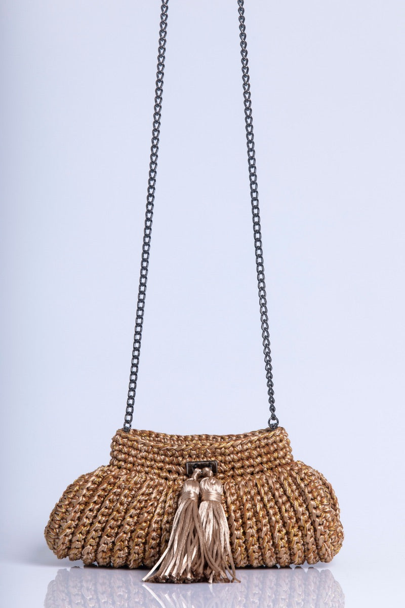Gold Catarina Mina Cantiga clutch bag with elegant design, featuring a sleek, shiny finish and compact style for evening occasions.