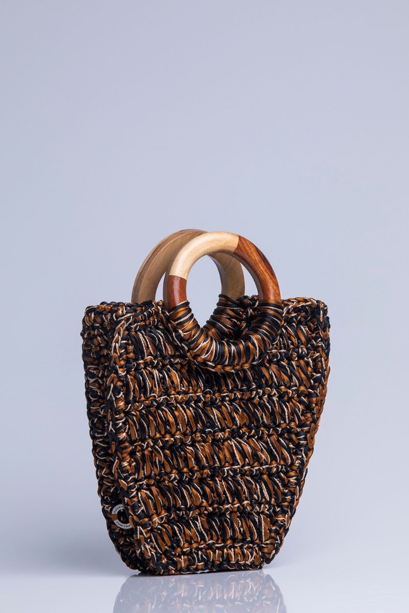 Black and brown Catarina Mina Danza top handle bag with structured design and elegant leather finish.