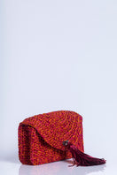 Catarina Mina Horizonte shoulder bag in vibrant grape-orange color, featuring stylish design and adjustable strap.