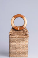 Catarina Mina top handle bag with a sleek milk-colored design, featuring sturdy handles and a minimalist style.