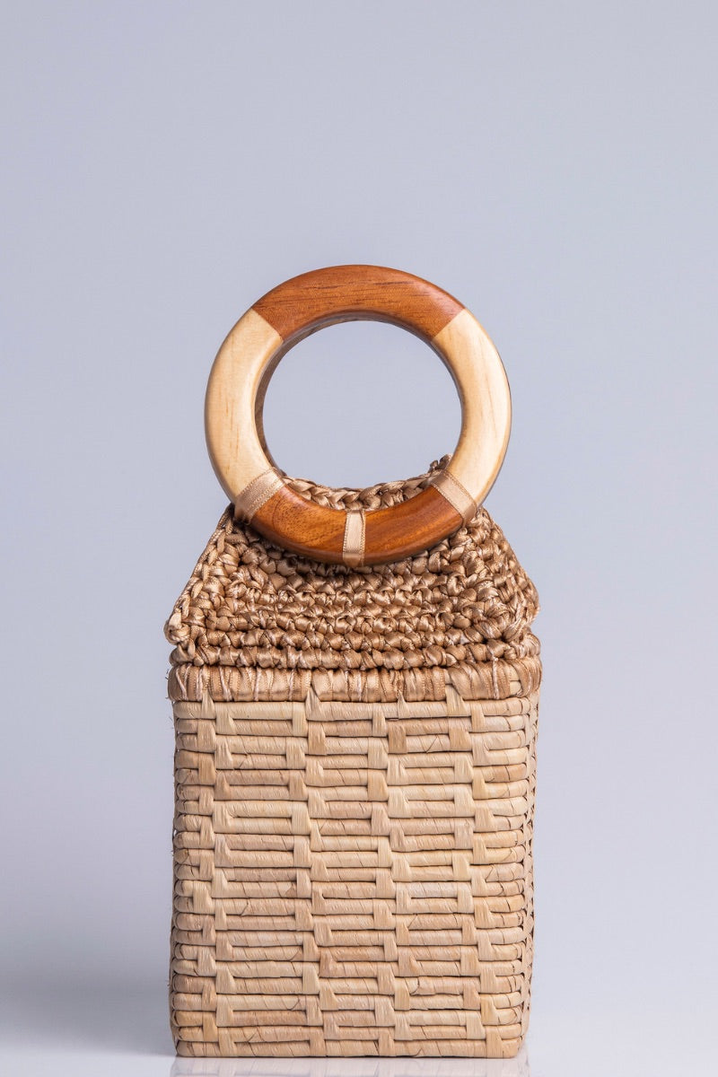 Catarina Mina top handle bag with a sleek milk-colored design, featuring sturdy handles and a minimalist style.