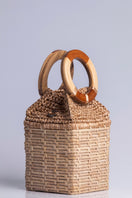 Catarina Mina top handle bag in milk color, featuring a sleek design with a sturdy strap and minimalist style.