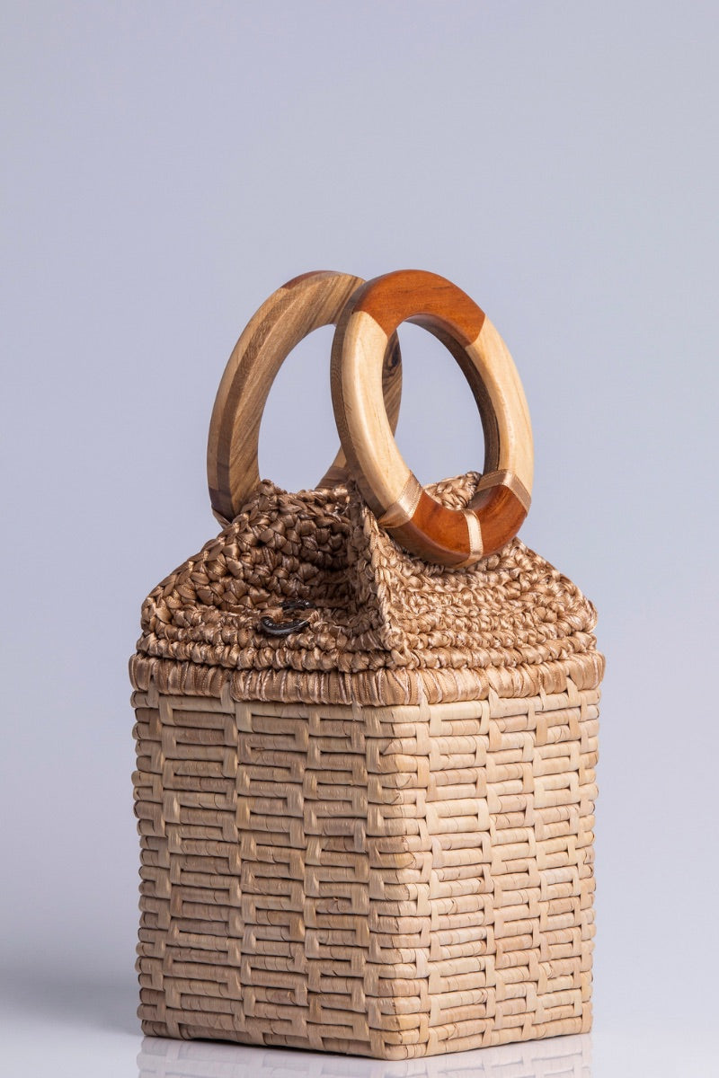 Catarina Mina top handle bag in milk color, featuring a sleek design with a sturdy strap and minimalist style.