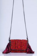 Catarina Mina Mira shoulder bag in vibrant grape orange with adjustable strap and stylish design.