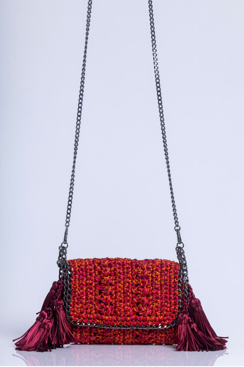 Catarina Mina Mira shoulder bag in vibrant grape orange with adjustable strap and stylish design.