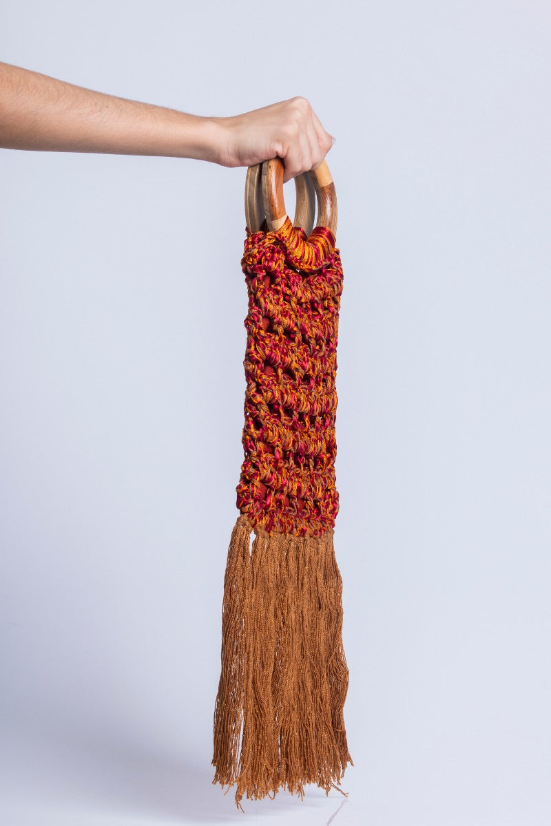 Catarina Mina Vera grape-orange top handle bag with structured design and leather handles, stylish and versatile accessory.