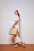Catarina Mina top handle bag with tie-in sand-colored design, stylish and versatile accessory for everyday use.