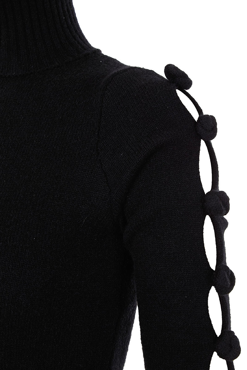 Black BASIC BOWS sweater by MAZ Manuela Álvarez, featuring a classic knit design and bow accents, shown in a close-up view.
