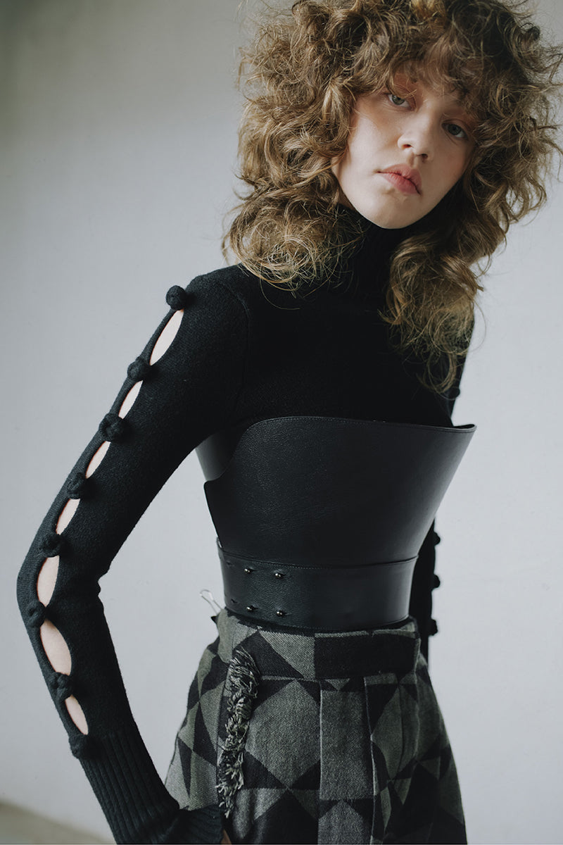 Black MAZ Manuela Álvarez BASIC BOWS sweater featuring a cozy knit design and a stylish bow detail at the neckline.