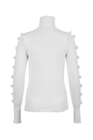 White BASIC BOWS sweater by MAZ Manuela Álvarez featuring a cozy knit and bow detail, perfect for casual and chic looks.