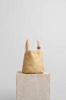 Beige raffia basket bag with top handle from Folklore The Label, showcasing natural woven texture and stylish design.