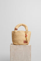 Beige raffia basket bag with top handle from Folklore The Label, stylish and spacious for casual outings.