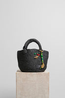Black raffia basket bag with top handle from Folklore The Label, showcasing woven texture and stylish design.