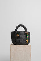 Black raffia basket bag with top handle from FolkLore The Label, showcasing a stylish woven design and spacious interior.