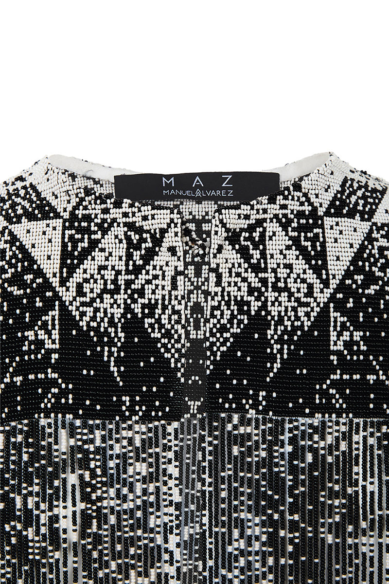 Beaded shoulder pads body jewelry by MAZ Manuela Álvarez with colorful beads and intricate design on a neutral background.