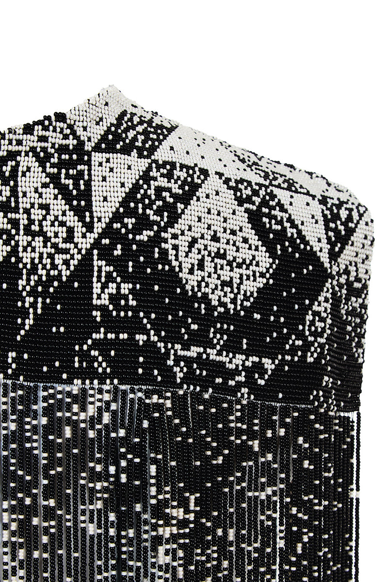 Beaded shoulder pads body jewelry by MAZ Manuela Álvarez featuring colorful beads and decorative design on the shoulders.