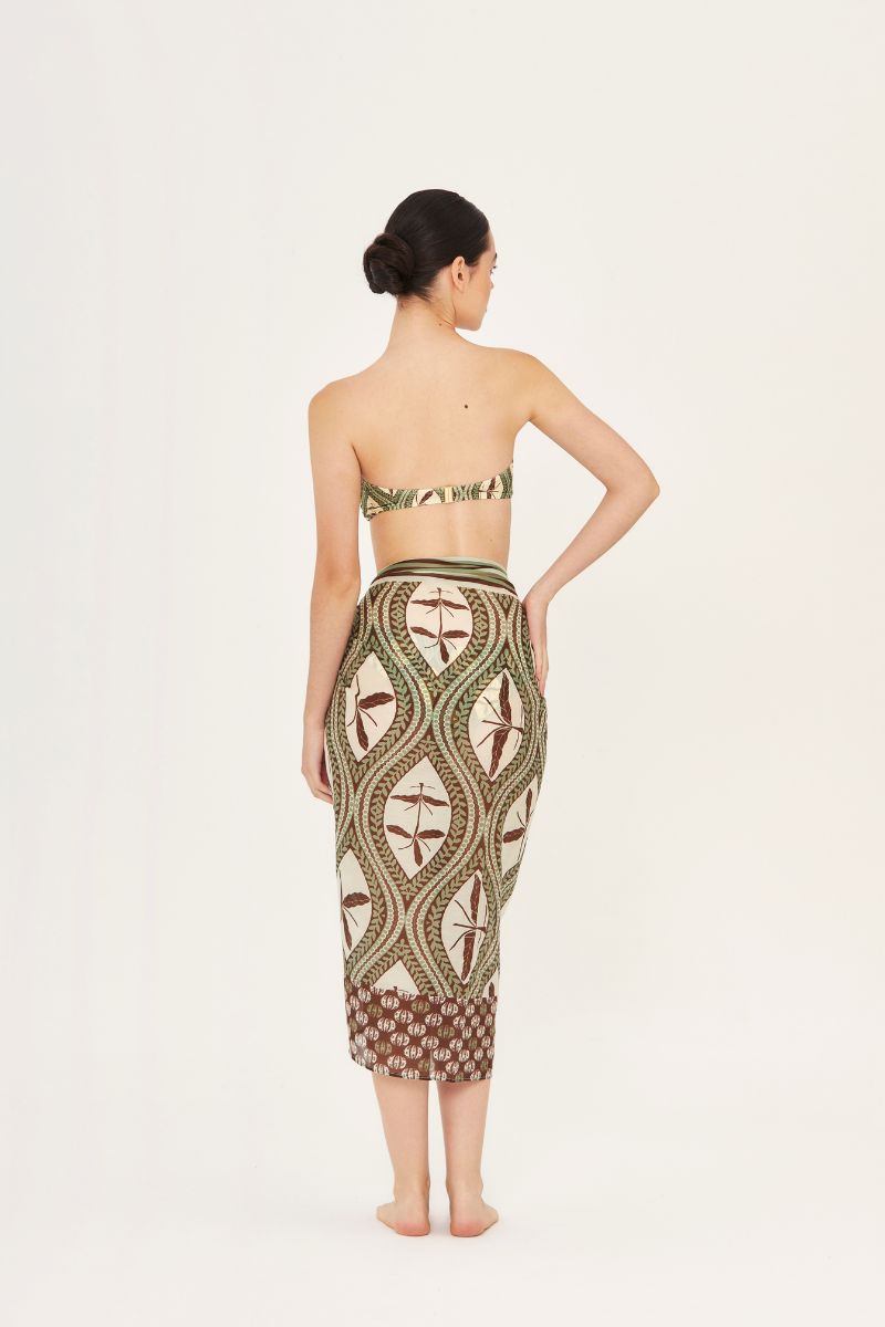 Aaguaclara Bedouine Pareo cover-up with vibrant, lightweight fabric, styled as a versatile beach wrap or skirt.