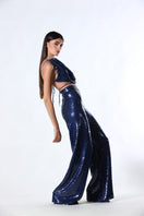 A pair of blue ZAYA pants from Aquarel Studio, showcasing a stylish and comfortable design with a relaxed fit.