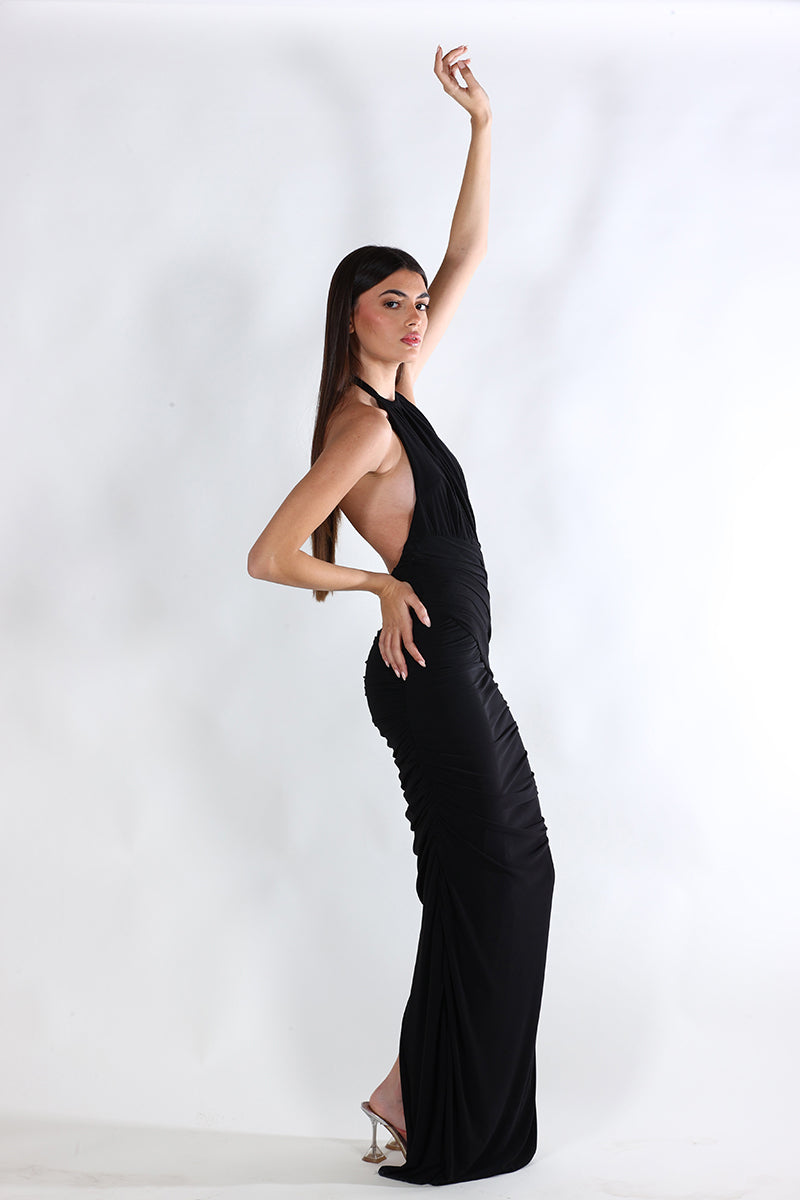 Black Stella maxi dress by Aquarel Studio, flowing fabric and elegant design, shown on a model in the image.