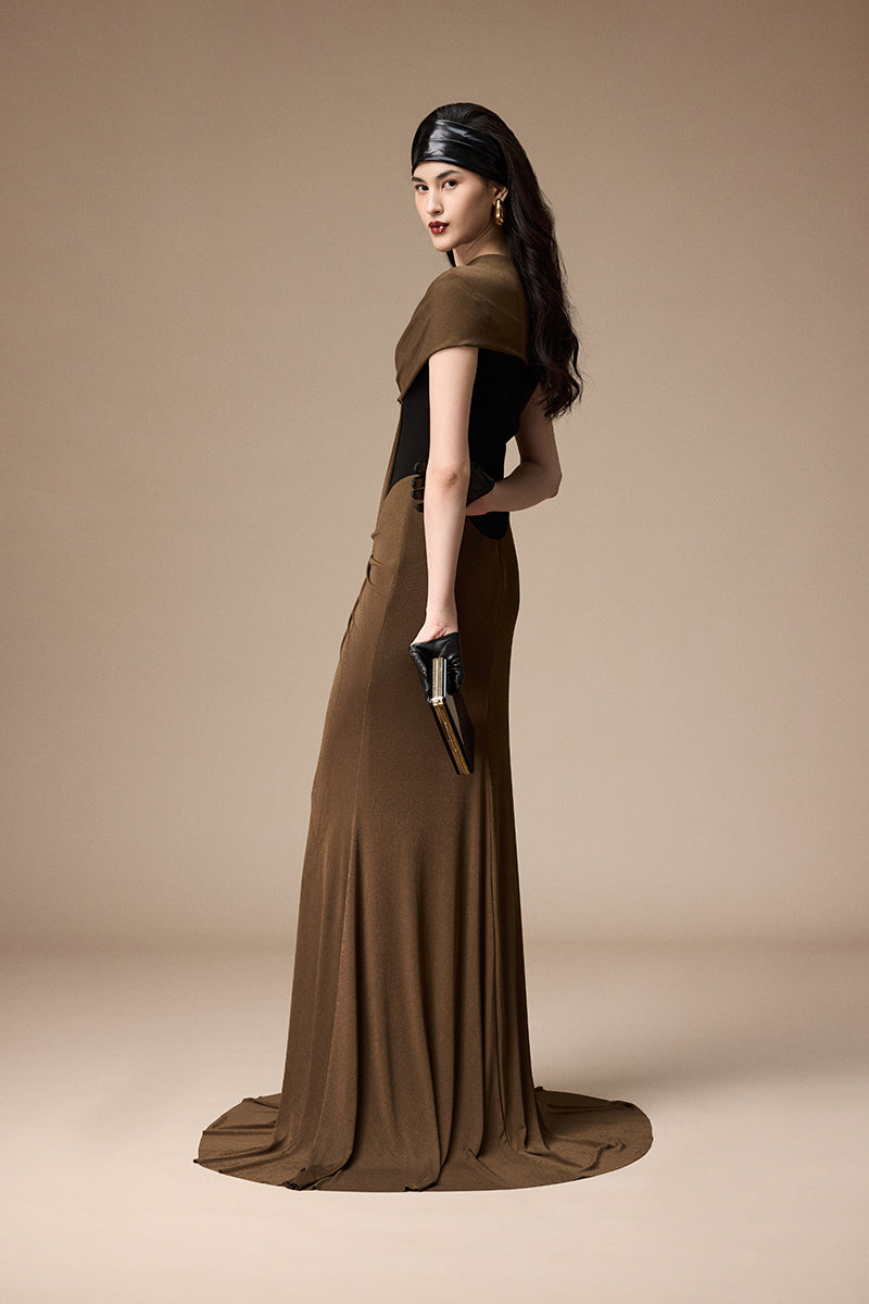 Elegant Jenny K Tran Bessie gown in black and umber fabric, featuring a flowing silhouette and intricate detailing.