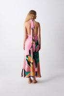Sisters Bianca dress in taffy pink, a flowing maxi dress with a fitted bodice and soft fabric, perfect for elegant occasions.
