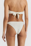 Seaquelle bikini top and twisted bikini bottom in creme white, featuring a stylish and comfortable swimwear set for summer.