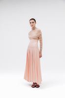 Studio NK Bloom Peach Maxi Skirt, flowy and lightweight with a floral design, styled for a casual or dressy look.