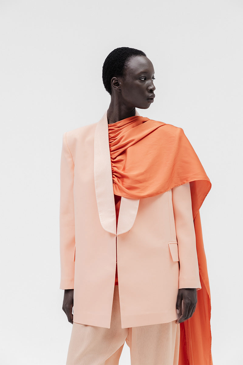 Studio NK ETHERAL Peach Blazer, stylish tailored blazer with a soft peach color, displayed on a neutral background.