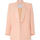 Studio NK ETHERAL peach blazer shown on a model, featuring a tailored fit and stylish lapel for a sophisticated look.