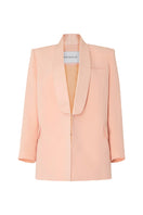 Studio NK ETHERAL peach blazer shown on a model, featuring a tailored fit and stylish lapel for a sophisticated look.