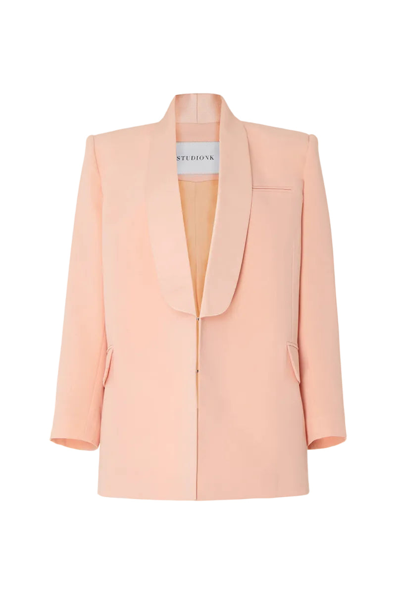 Studio NK ETHERAL peach blazer shown on a model, featuring a tailored fit and stylish lapel for a sophisticated look.