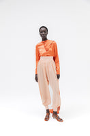 Studio NK Bloom Peach Pants, stylish women's trousers with a comfortable fit, shown in a soft peach color.