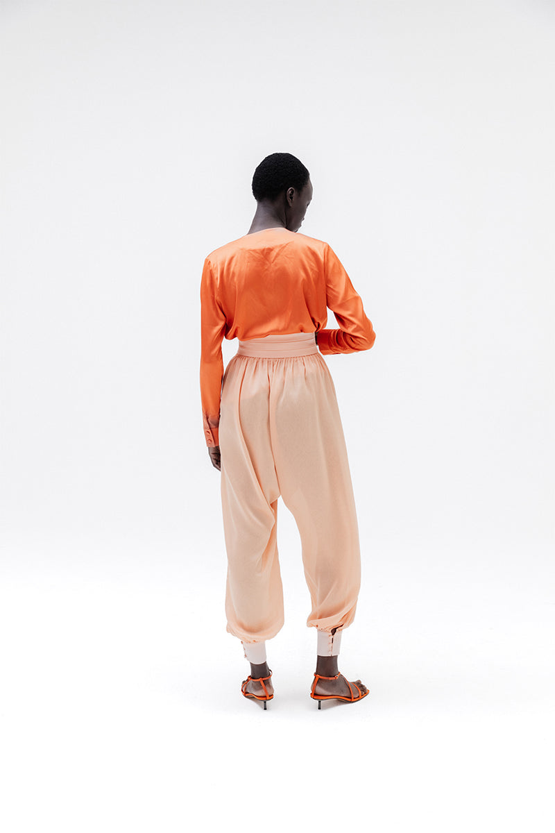 Studio NK Bloom Peach Pants, stylish women's trousers with a relaxed fit and soft peach color, perfect for casual wear.