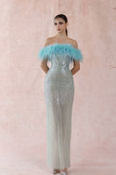 Blue feather sequin gown by HACCHIC COUTURE featuring shimmering blue feathers and intricate sequin details.