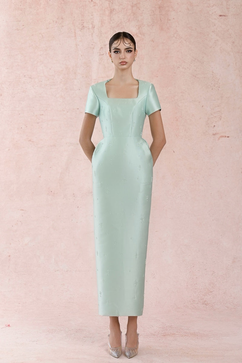 Blue minimal square neck gown by HACCHIC COUTURE, featuring a sleek design and elegant fit, displayed on a model.