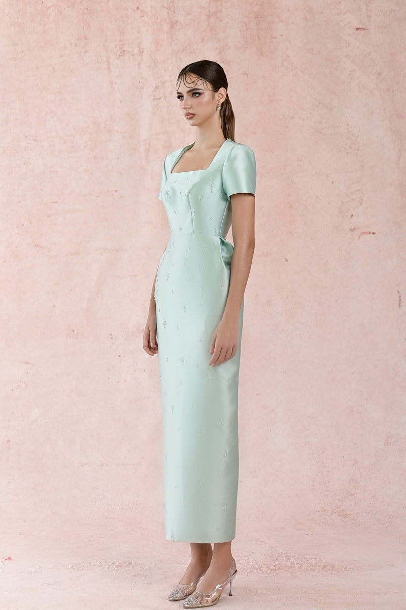 Blue minimal square neck gown by HACCHIC COUTURE, featuring a sleek silhouette and elegant design.