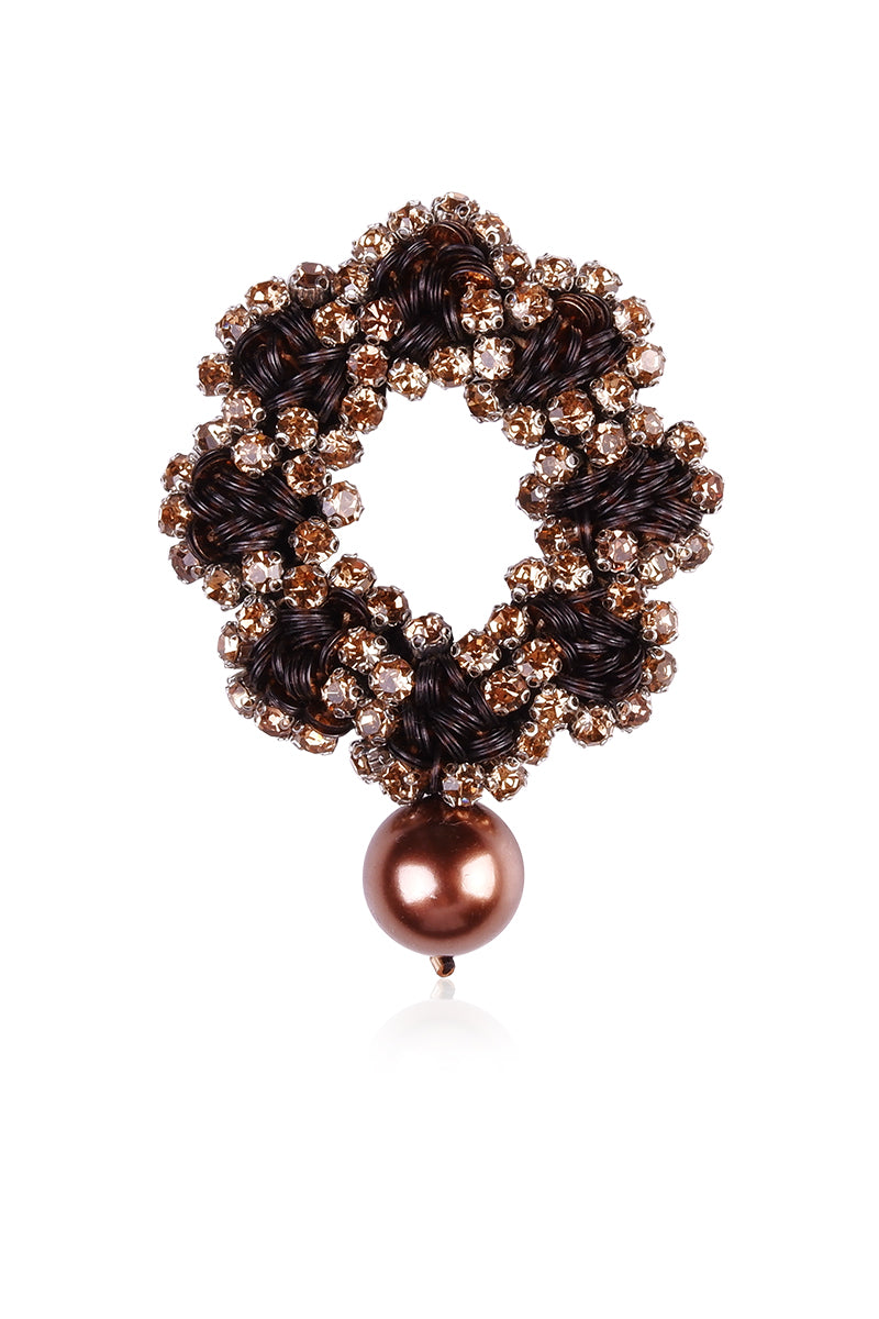 Golden Flow brooch by Aidan & Ice, elegant metal pin with a flowing design suitable for lapels and accessories.