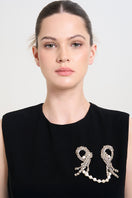 Aidan & Ice Pearls Estheria brooch featuring elegant pearl accents on a floral-shaped lapel pin.