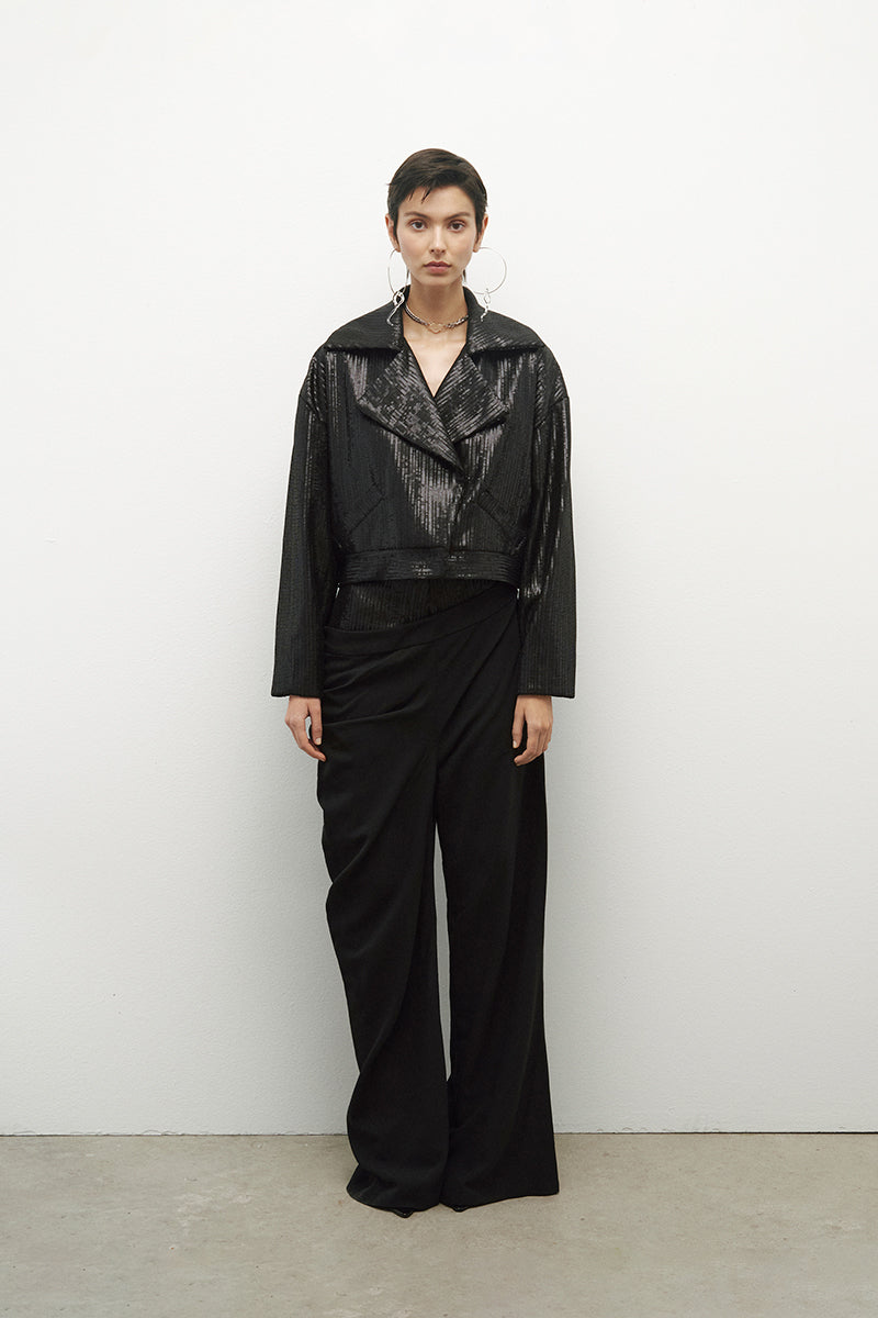 JC Pajares biker jacket with mini paillettes, featuring a stylish black design and metallic embellishments.