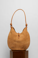 Beige suede boho shoulder bag from Folklore The Label with a relaxed, stylish design and natural leather strap.