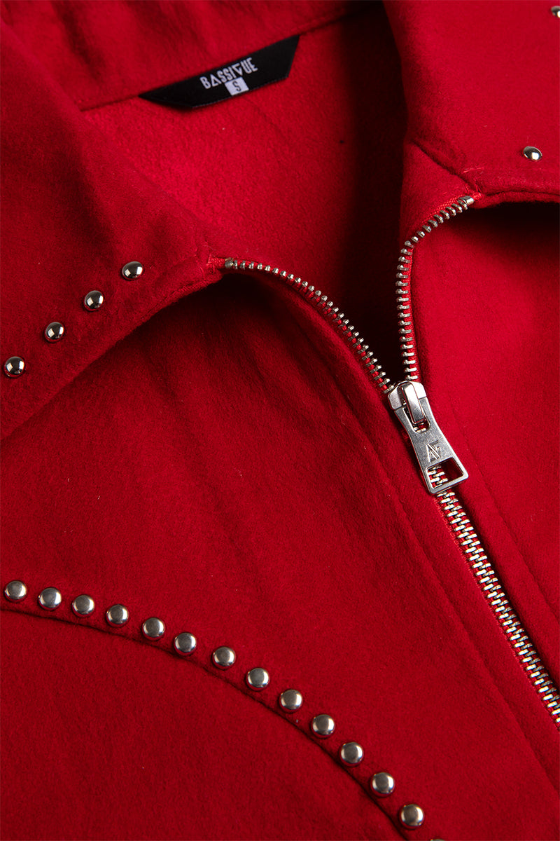 Black Bassigue studded jacket with metal studs, stylish outerwear featuring a modern design on a plain background.