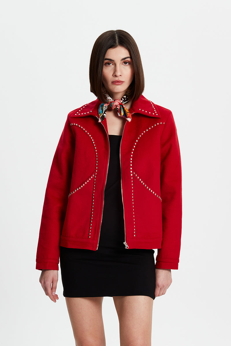 Black studded jacket from Bassigue with metal stud embellishments, tailored fit, and classic collar, stylish outerwear for edgy fashion.
