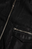 Metallic coated jacket from Bassigue, stylish and shiny jacket with a sleek metallic finish, displayed on a hanger.