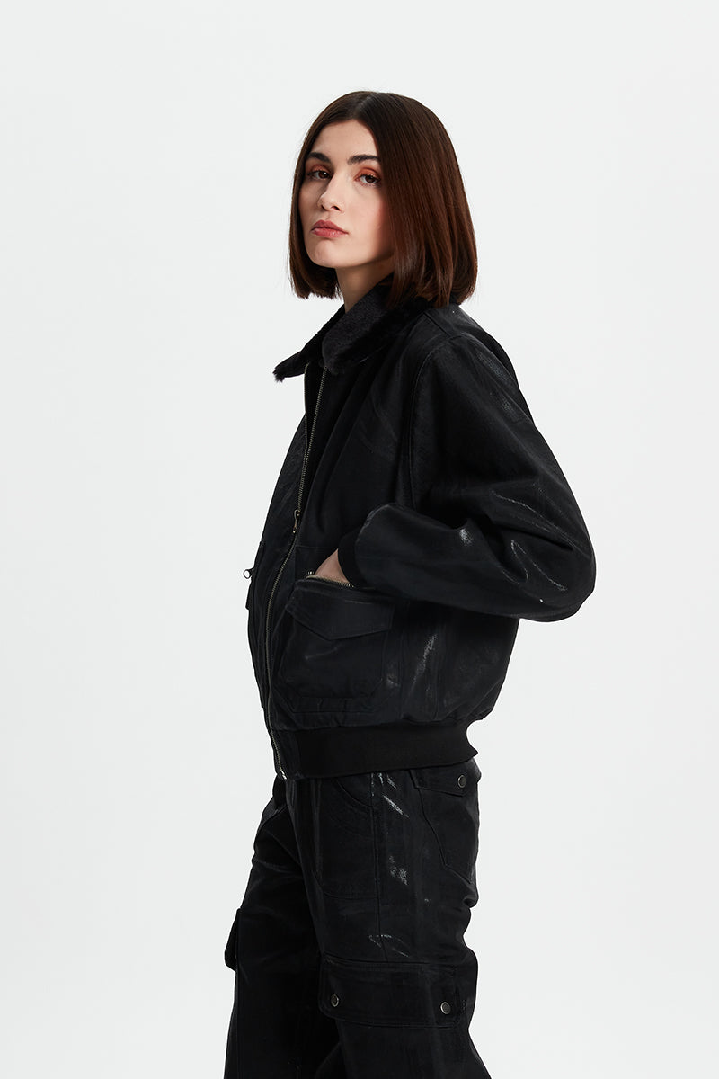 Metallic coated jacket from Bassigue, stylish jacket with a shiny metallic finish, displayed on a hanger.