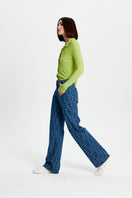 Bassigue laser print straight leg jeans, showing a close-up of the dark denim fabric with laser-printed detailing.